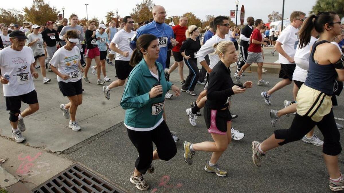 Runners start the Turkey Day 5K run in downtown Columbia.