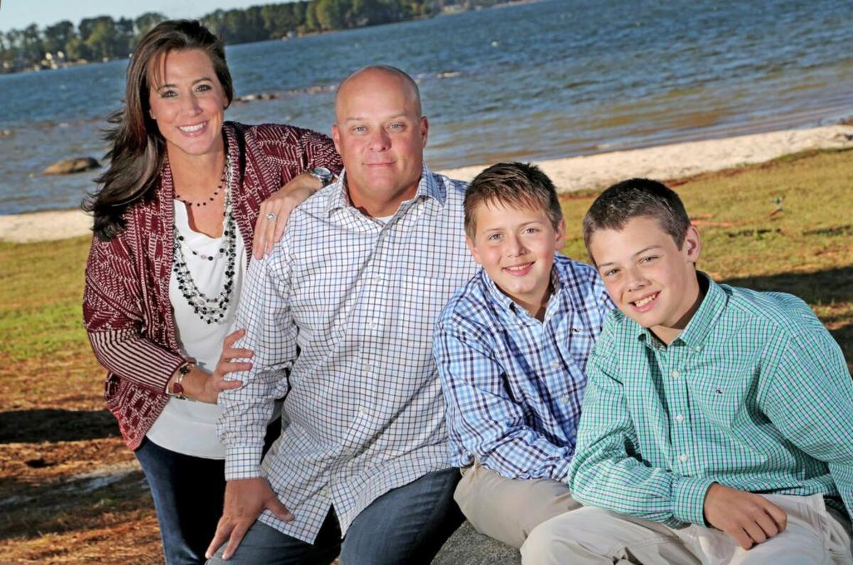Jenn and Chad Holbrook with their sons, Reece and Cooper, in 2014.
