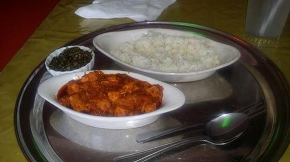 Harambe Ethiopian Restaurant’s tibs – a beef ribeye cooked with onion, rosemary, jalapenos and tomatoes – is served with gomen (collard greens) and rice.
