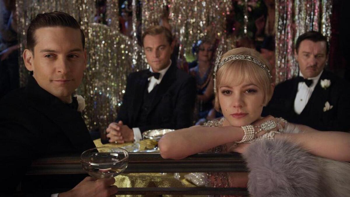 Tobey Maguire, from left, as Nick Carraway, Leonardo DiCaprio, as Jay Gatsby, Carey Mulligan as Daisy Buchanan and Joel Edgerton as Tom Buchanan in Warner Bros. Pictures and Village Roadshow Pictures drama, “The Great Gatsby.”