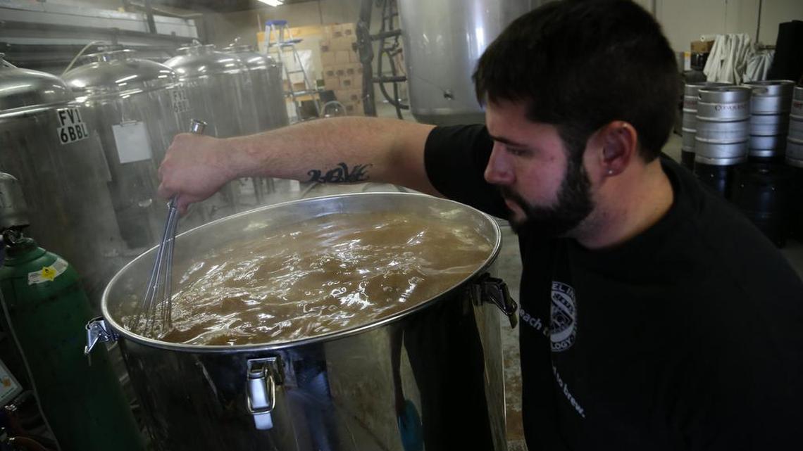 Joseph Ackerman brews a batch of beer at Conquest Brewing.