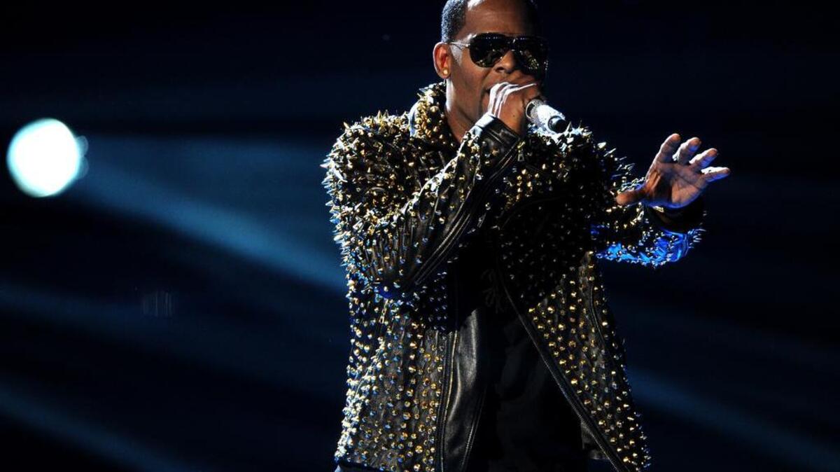 R. Kelly performs onstage at the BET Awards in 2013.