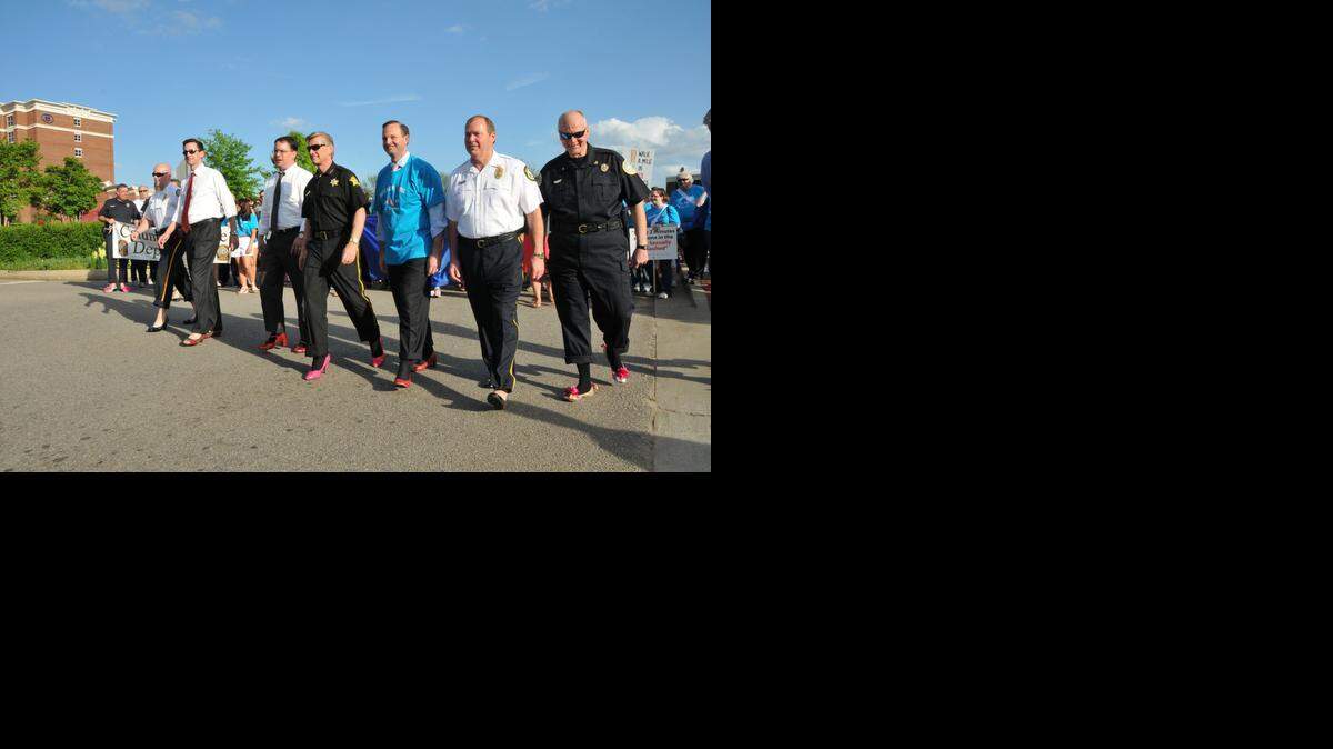 
Men from across the midlands will come together Wednesday to do the .7-mile walk in women's shoes to take a stand against sexual assault and abuse. Here, the ambassadors for the 2013 "Walk A Mile In Her Shoes" event included Richland County Sheriff Leon Lott. 
