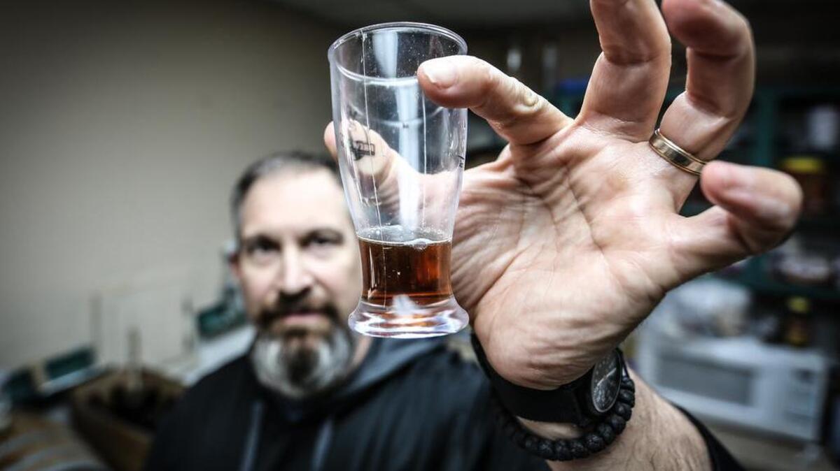 D.I.Y. BrewHouse proprietor JP Tolan examines our stout.