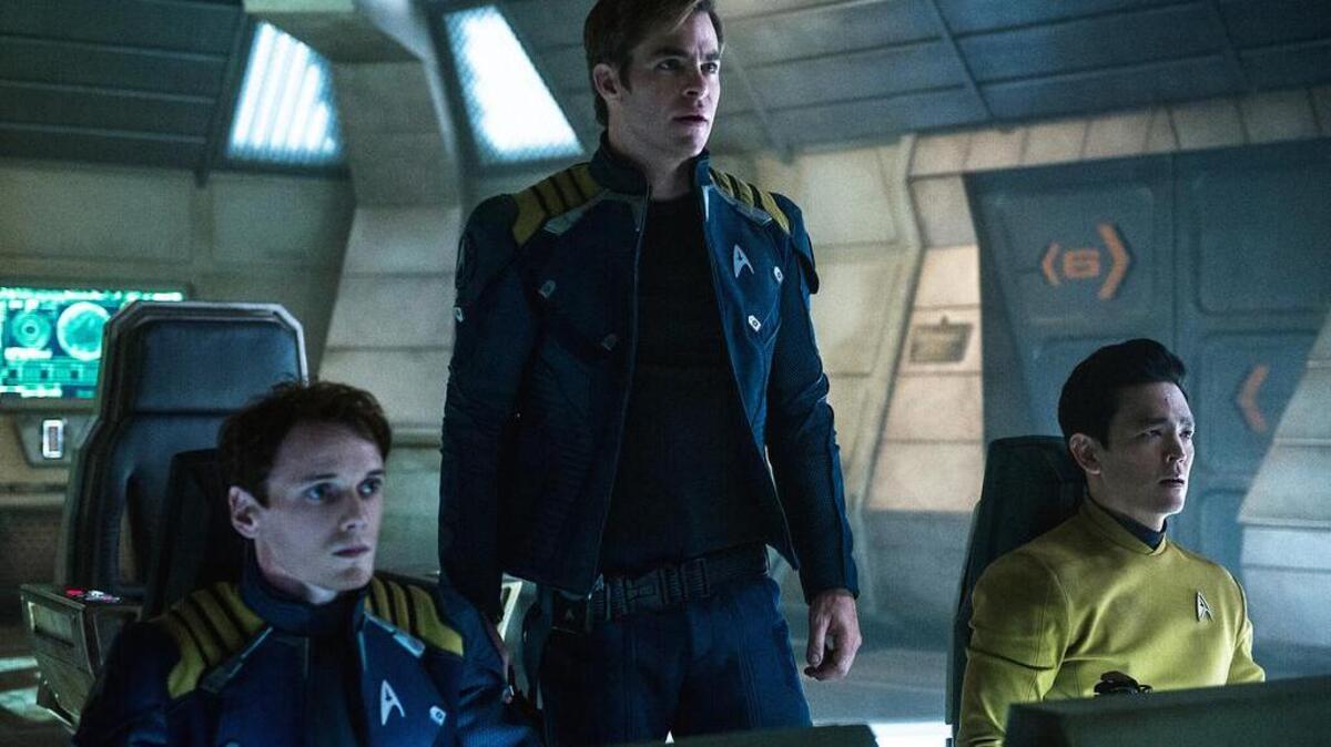 From left, Anton Yelchin, Chris Pine and John Cho appear in a scene from “Star Trek Beyond.”