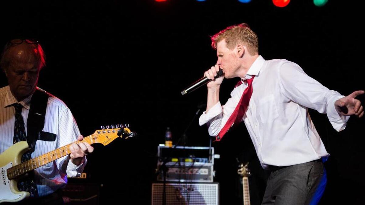 Patrick Davis, right, on stage with his father, Rusty Davis.