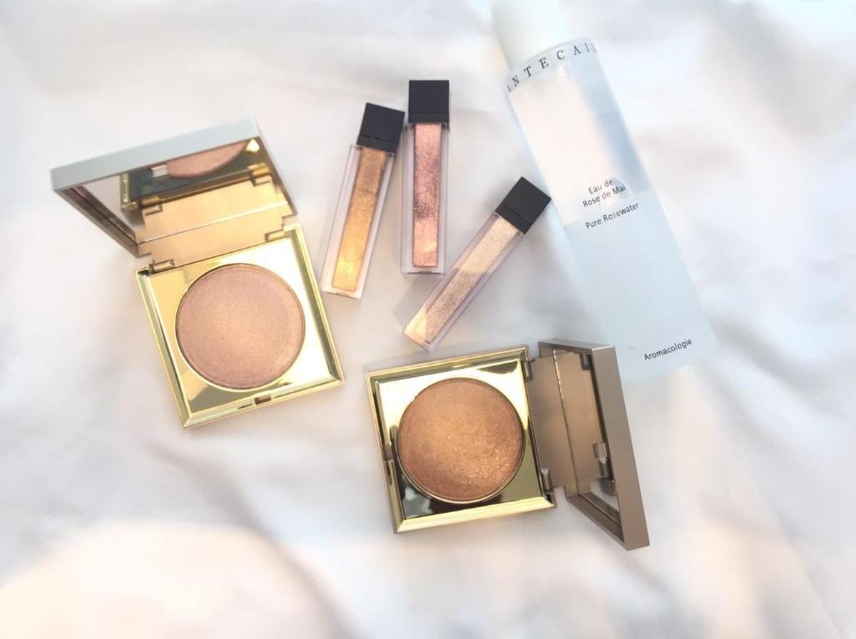 Stila kitten and bronze highlighter, $36; Jouer lip toppers (tan lines, St. Tropez and rose gold), $16 each; Chantecaille rose de mai pure rosewater, $68; all at Pout.