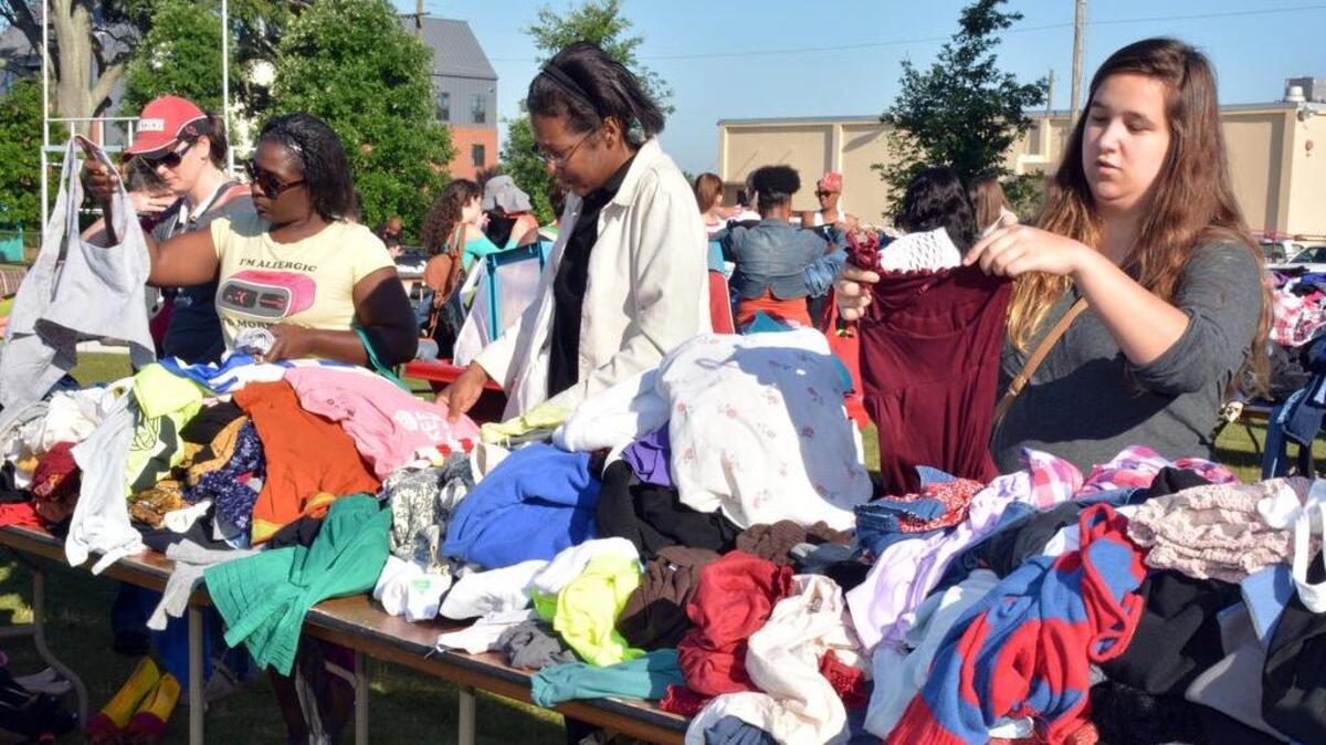Bargain hunters storm USC’s Greene Street intramural field for the university’s annual giant, end-of-the-year Give it Up for Good yard sale last year. From second left, Tekora Burns and Michelle Franklin of West Columbia and Nina Davis of Columbia shop for deals.