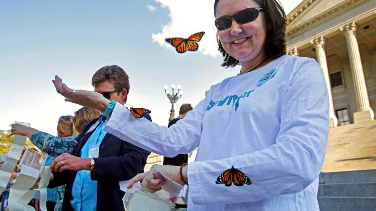 Sharon Watson, a cancer survivor, releases her butterfly during last year’s event.