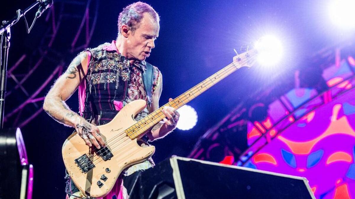 Flea of Red Hot Chili Peppers performs on day 3 of Lollapalooza on Saturday, July 30, 2016, in Chicago. (Photo by Amy Harris/Invision/AP)