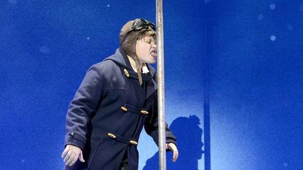 Flick accepts the triple-dog-dare as his classmates look on in “A Christmas Story: The Musical.”
