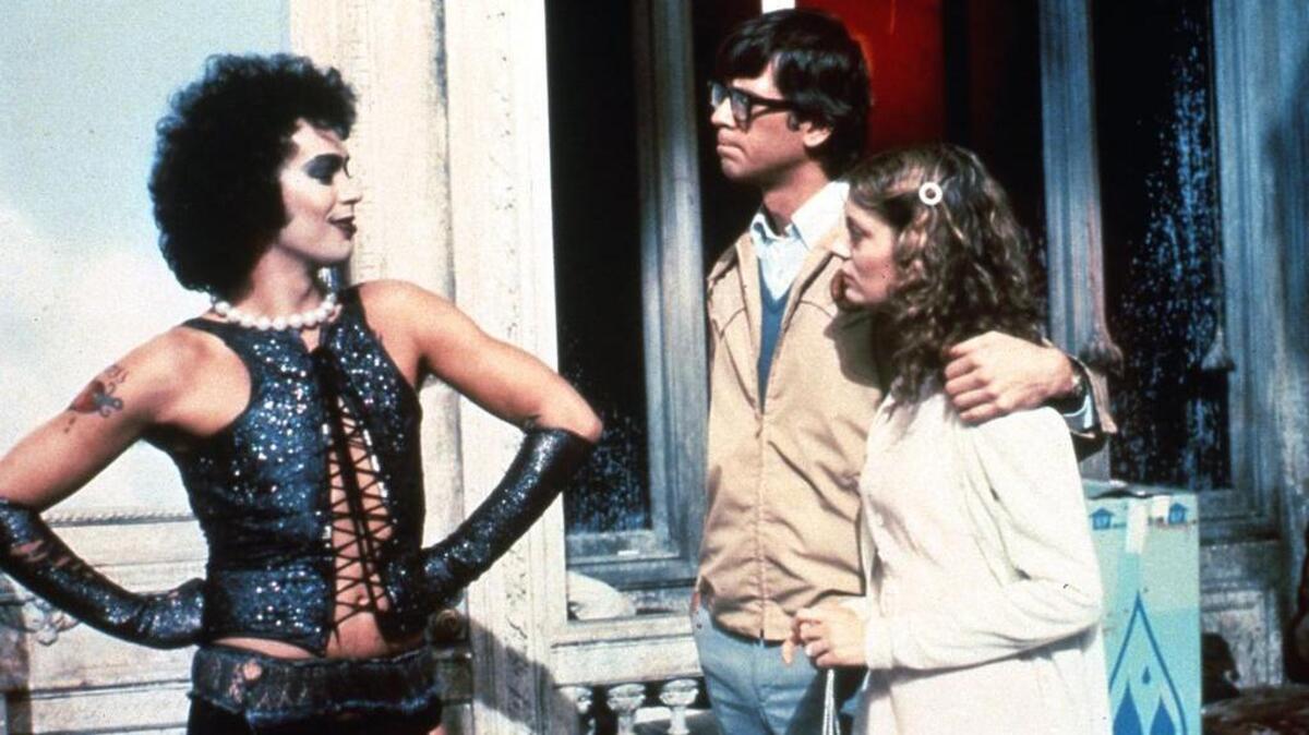 Dr. Frank-N-Furter (Tim Curry), Brad Majors (Barry Bostwick) and Janet Weiss (Susan Sarandon) are shown in a scene from “The Rocky Horror Picture Show.” Just in time for Halloween, “The Rocky Horror Picture Show” gets the big screen treatment at the Carolina Theatre.