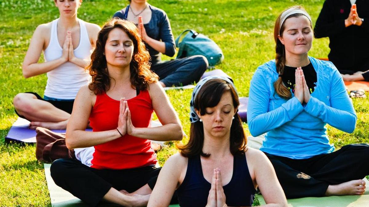 Sustainable Carolina's celebrated the first day of Spring on with Grassroots Yoga on the small field by the Russell House at USC, led by Stacey Millner-Collins of Columbia's City Yoga.
