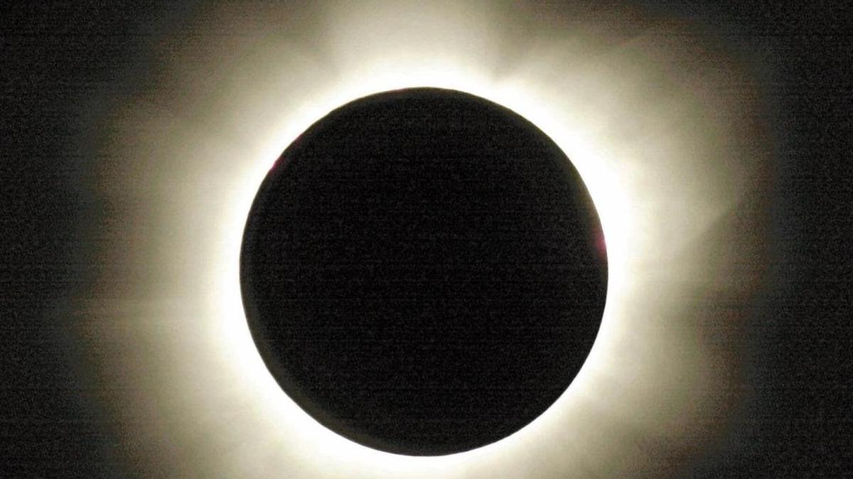 The sun’s outer atmosphere or corona is laced with delicate streamers as it shines around the dark disk of the moon during the total solar eclipse as viewed in Zambia, northwest of Lusaka, Thursday, June 21, 2001.