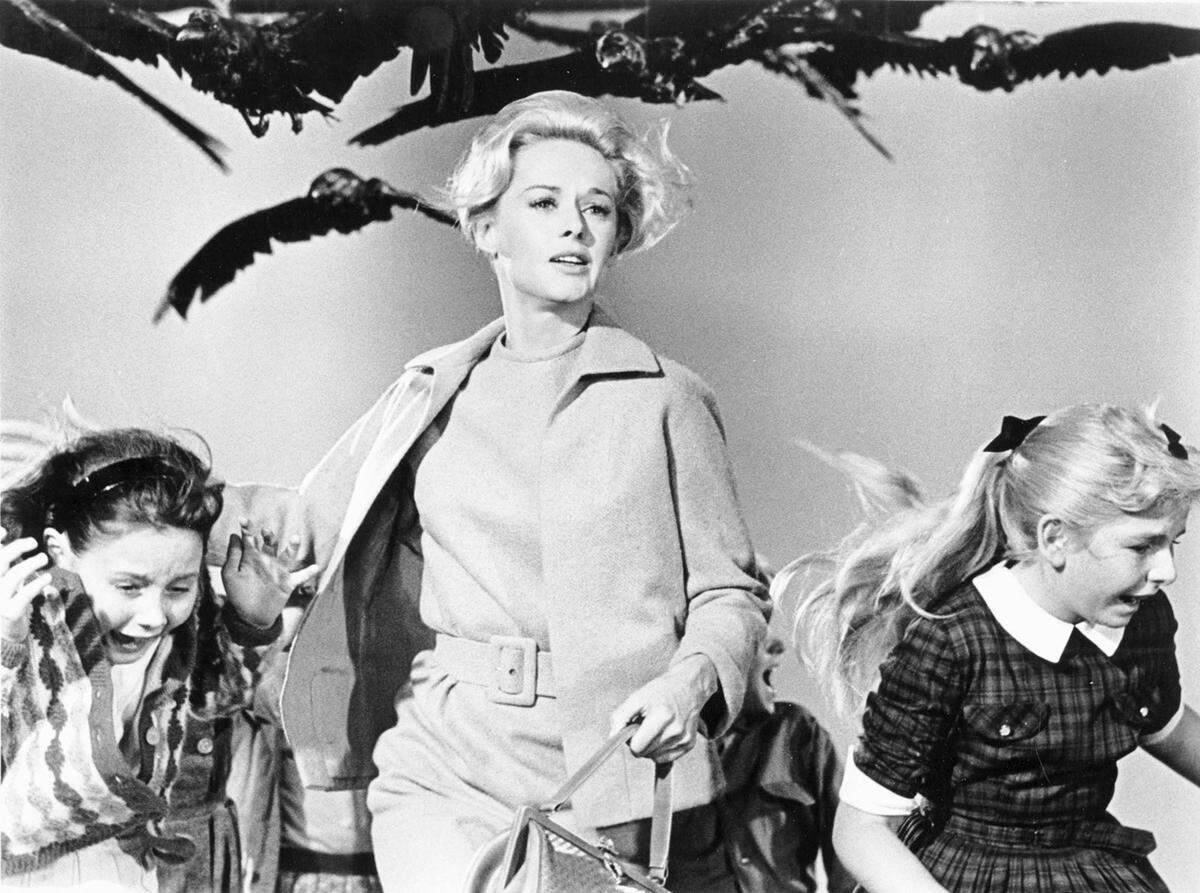 Tippi Hedren, center, stars in “The Birds” (1963), directed by Alfred Hitchcock.