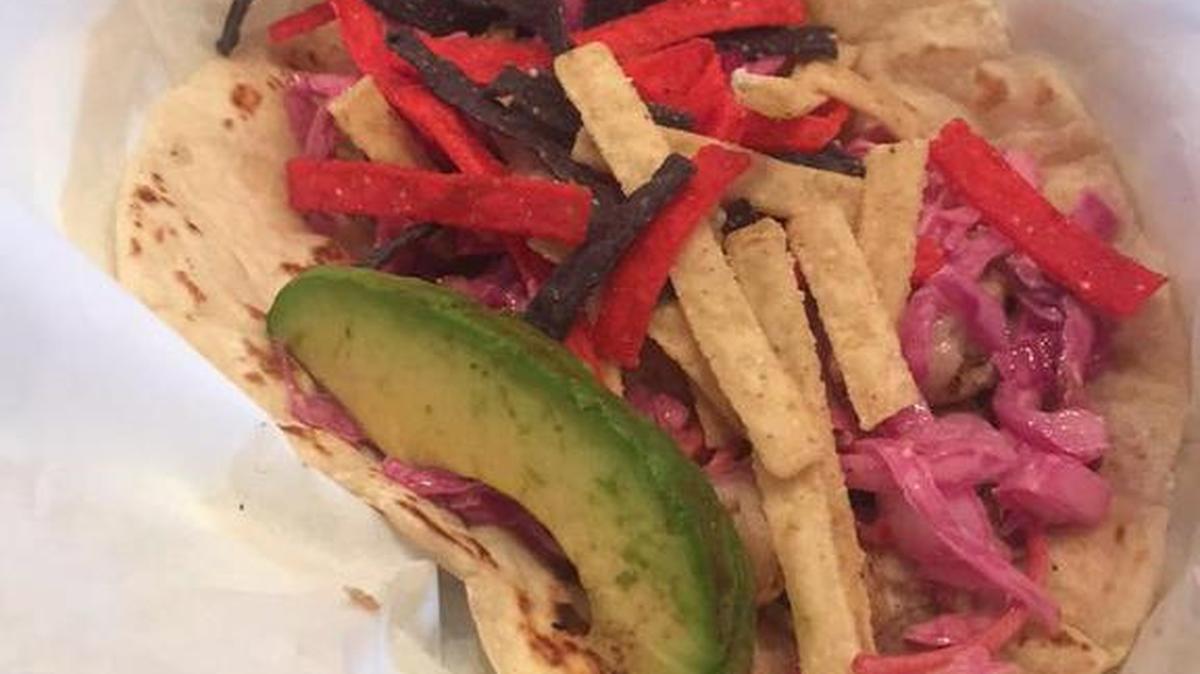 The Moby Dick taco has grilled mahi mahi or shrimp, Mexican slaw, tortilla strips and avocado.