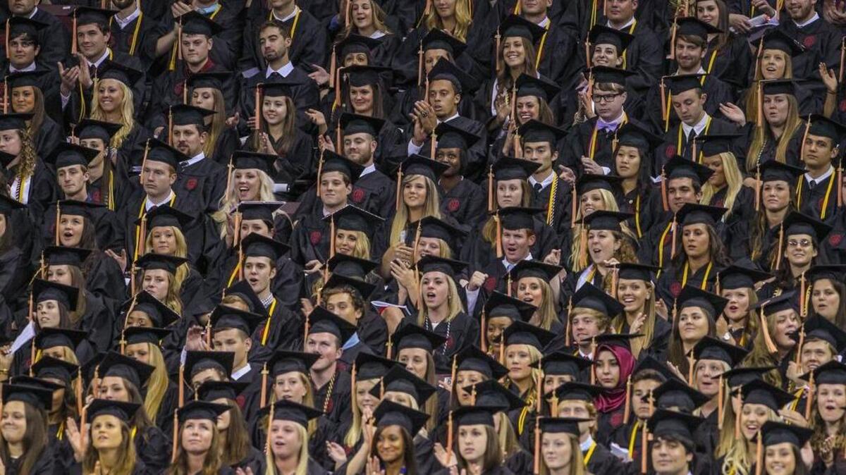 Graduates from the University of South Carolina listen to a commencement address.