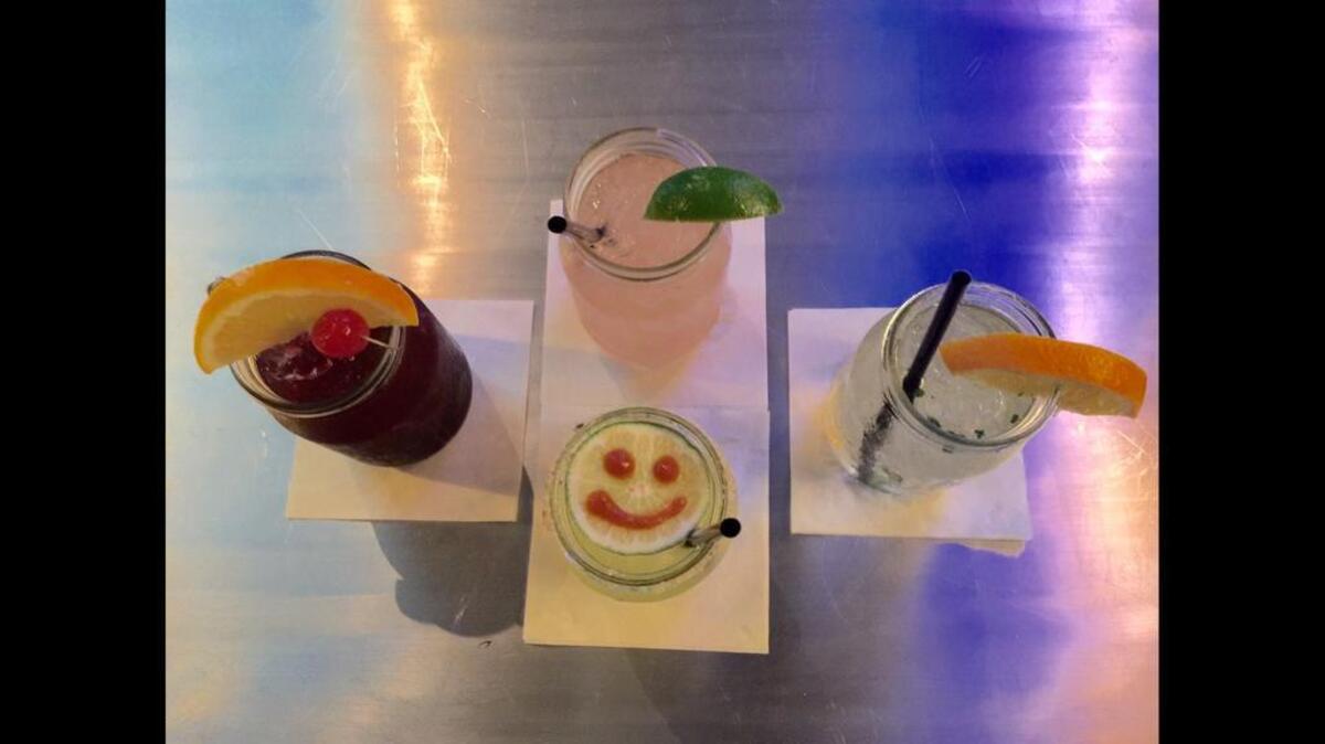 Drinks, anyone? Publico in Five Points, drinks clockwise: The Other Side of the Moon, The Soda City Saint, Publico “smiley face” Margarita and Publico Sangria
