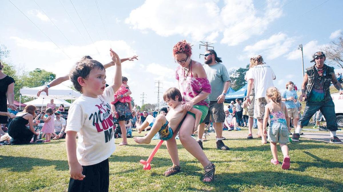 Festivalgoers rock out at a past River Rocks festival.