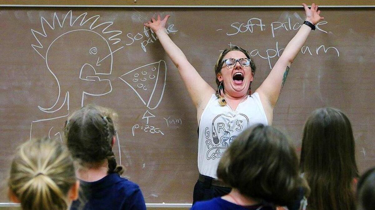 Instructor Jessica Gibbons discusses the importance of the soft palate and diaphragm when it comes to singing. During her workshop, Gibbons teaches the girls participating in Girls Rock Columbia about their voice and body.
