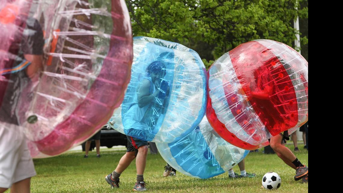 
A group of USC medical students play bubble ball on campus. The sport incorporates playing a modified game of soccer while wearing a 25-pound inflatable bubble. 
