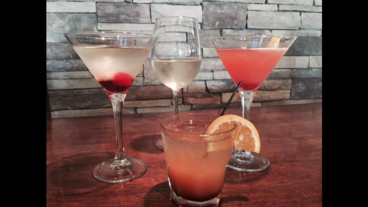 
Clockwise from top right are Social Grill’s martini, Domino Pinot Grigio, Girls’ Night Out martini and the Social Butterfly.
