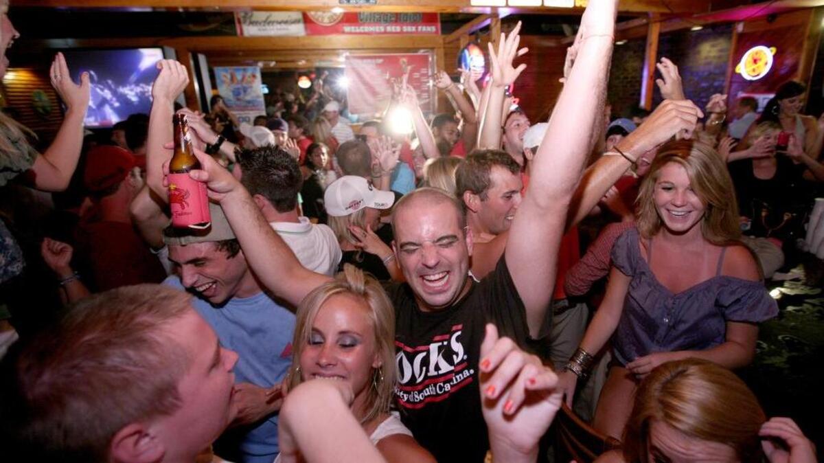 Gamecocks fans celebrate a win at Village Idiot.