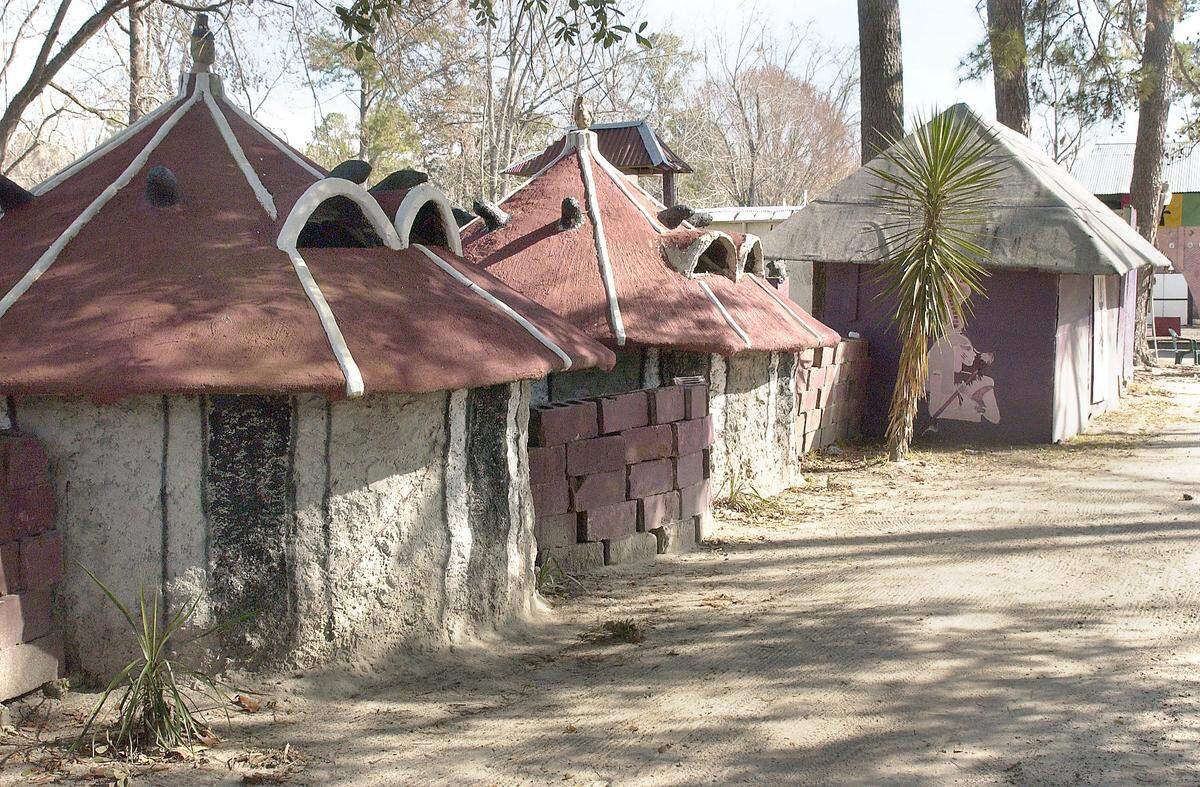 Homes are African-style stucco huts with cinder-block walls in the Oyotunji African Village in Sheldon. Many residents try to keep life very simple, the village’s king, Oba Adefunmi II, told the Beaufort Gazette in 2009.