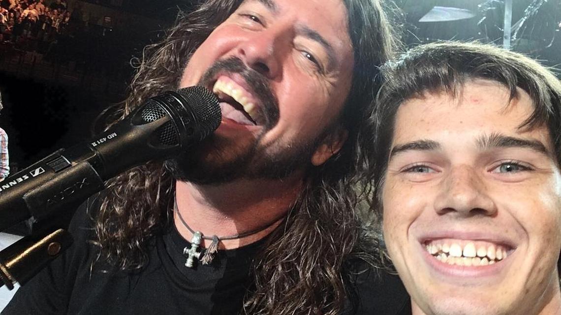 South Carolina sophomore Pierce Edge, right, snapped a selfie with Foo Fighters lead singer Dave Grohl after being pulled from the audience to play with the rock band in Tuesday’s concert at Colonial Life Arena.