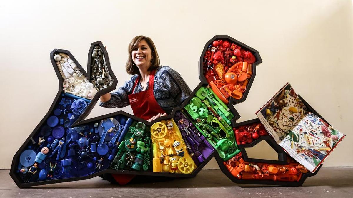 Kirkland Smith displays a piece she made for the Richland County Library at Vista Studios.