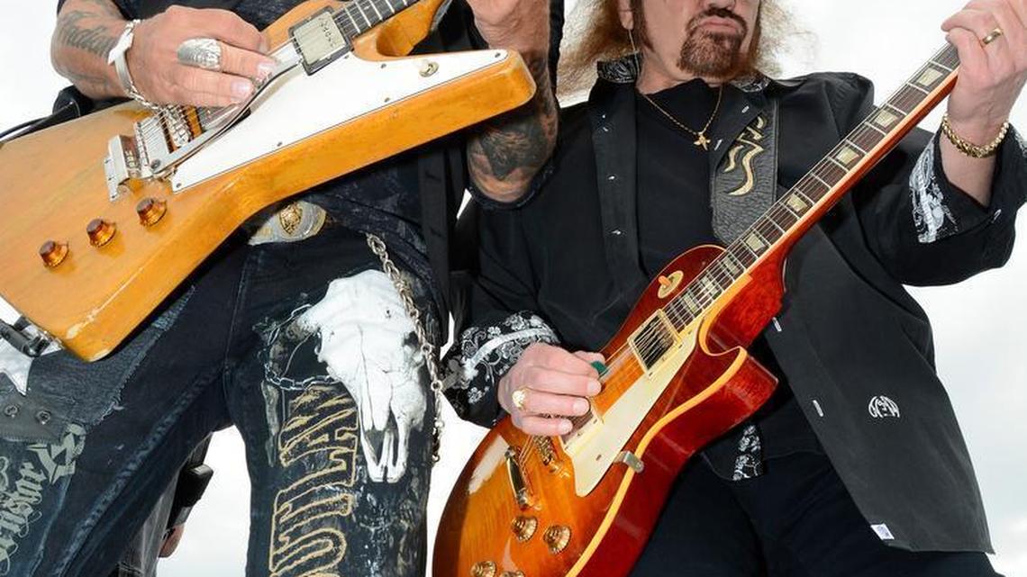 Lynyrd Skynyrd band members Rickey Medlocke, left, and Gary Rossington perform before the NASCAR Sprint Cup Series auto race at Texas Motor Speedway in Fort Worth, Texas, Saturday, April 9, 2016.
