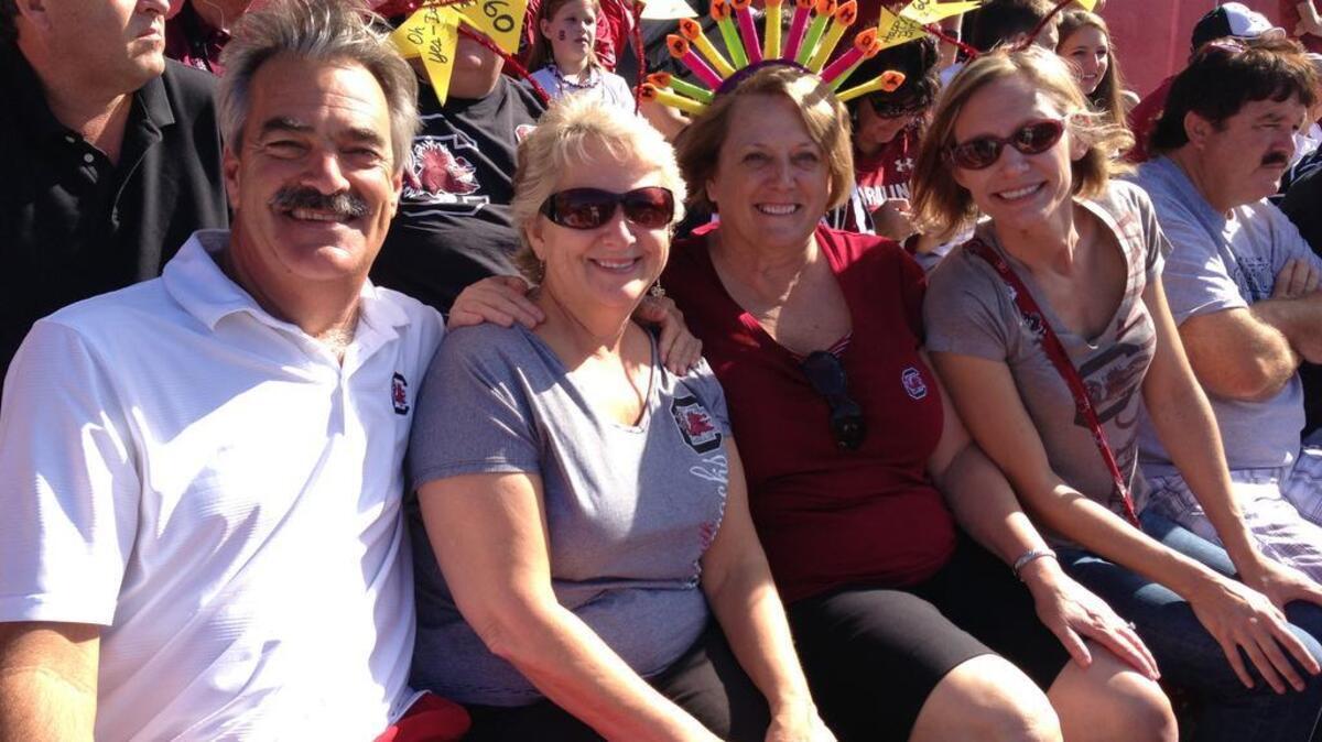 
Mike Stacey, left, with wife Sue and fellow tailgaters.
