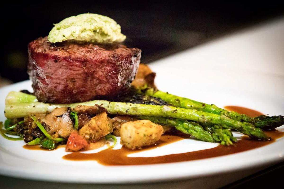 Saluda’s filet mignon is served with house-made gnocchi cooked in garlicky brown butter with pancetta, confit red onions, roasted tomatoes, wild mushrooms and spinach. The filet can also be served grilled asparagus and demi glace and topped with herb butter.