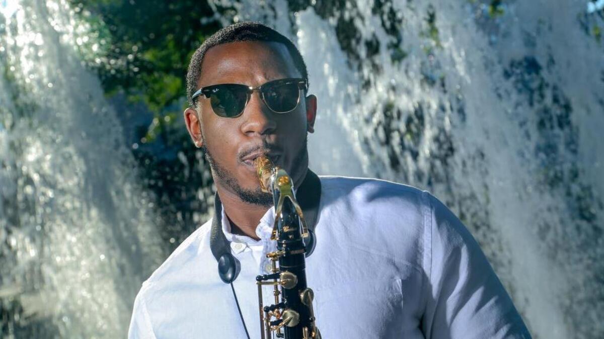 Darius Starks plays his saxophone in Columbia's Five Points.