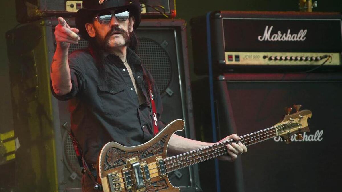 FILE - This June 26, 2015 file photo shows Motorhead bassist Lemmy Kilmister performing on the Pyramid stage during Glastonbury Music Festival at Worthy Farm, Glastonbury, England. Ian "Lemmy" Kilmister, the Motorhead frontman whose outsized persona made him a hero for generations of hard-rockers and metal-heads, has died on Monday, Dec. 28, 2015.