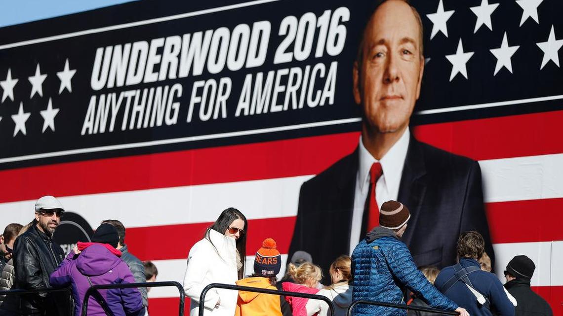 People stand in line waiting to enter the Underwood 2016 booth near the Peace Center where the CBS News Republican presidential debate will occur, Saturday, Feb. 13, 2016, in Greenville, S.C. Frank Underwood is a fictional character and the protagonist of the Netflix show House of Cards. He is portrayed by Kevin Spacey.