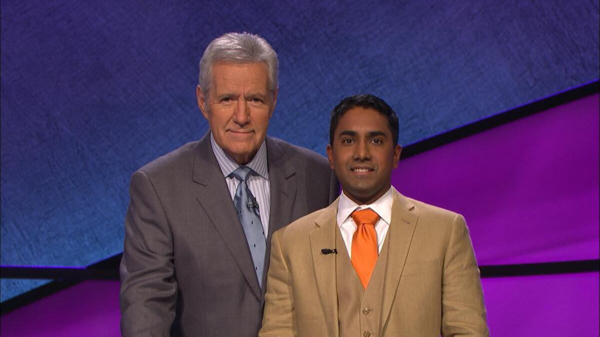 Nilanka Seneviratne, right, poses with ‘Jeopardy’ host Alex Trebek.