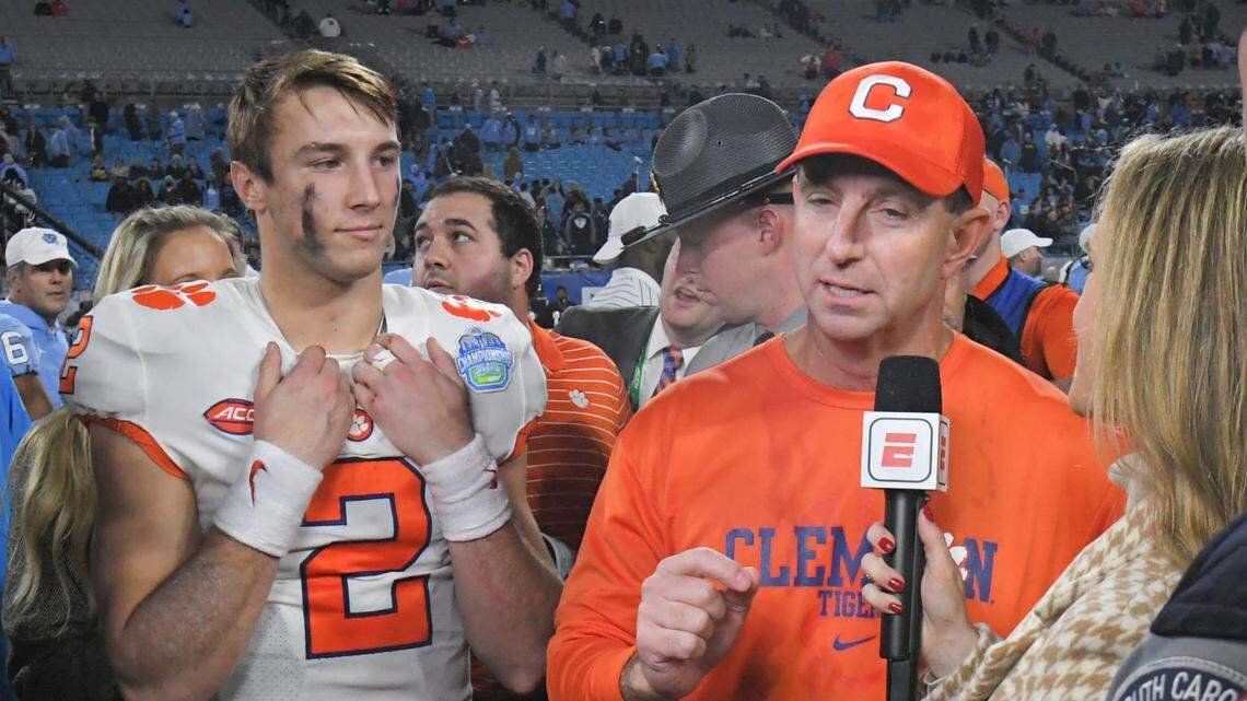 From Dec. 3: Clemson Tigers head coach Dabo Swinney is interviewed by ESPN as game MVP quarterback Cade Klubnik (2) looks on after defeating the North Carolina Tar Heels in the ACC Championship game at Bank of America Stadium. Clemson won 39-10.