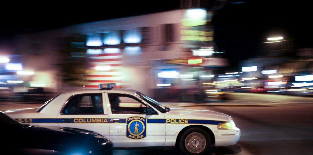 In this file photo a City of Columbia police officer makes his way down Harden Street in the heart of Five Points.