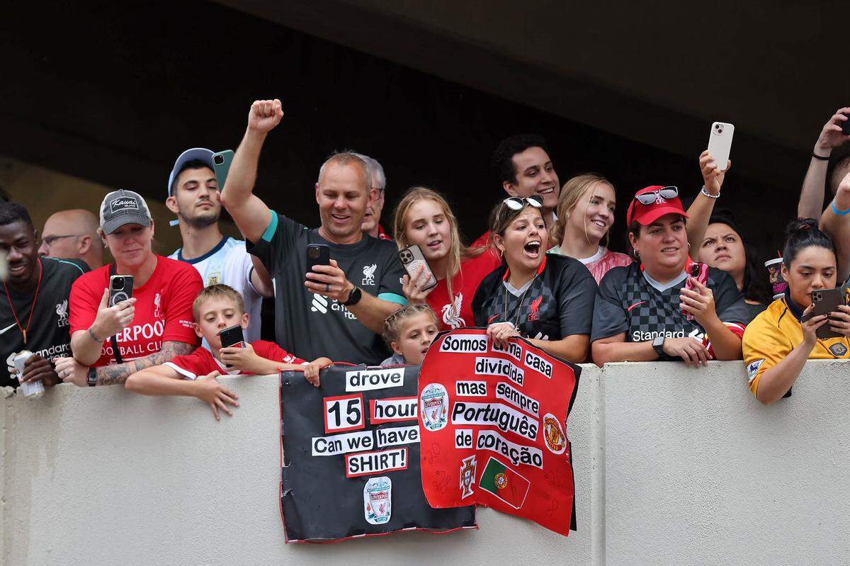 Fans cheer Saturday as the Manchester United and Liverpool soccer teams arrive for their friendly at Williams-Brice Stadium.