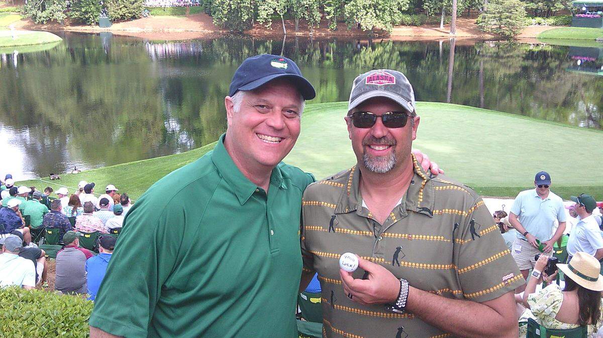 Augusta National patron Brian Snyder (right) poses with his buddy Jay Jones (Left) after catching an errant tee shot.