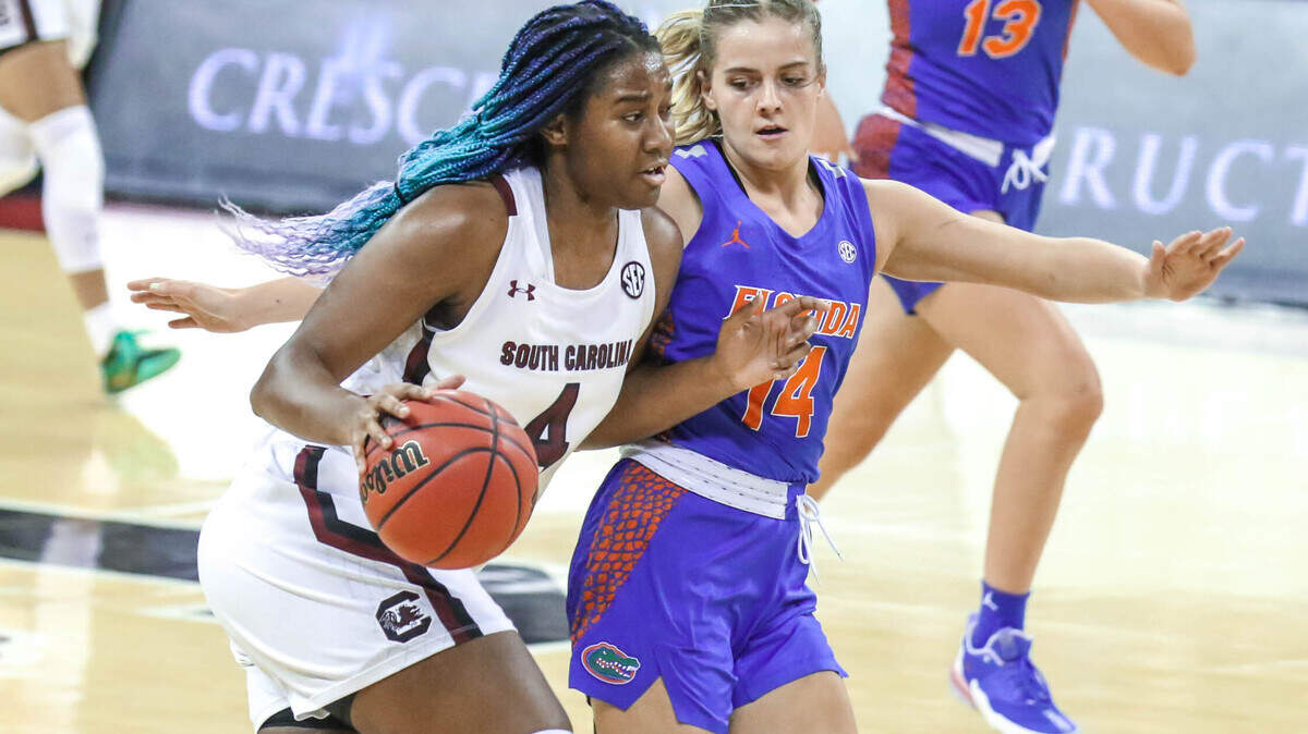 South Carolina Gamecocks forward Aliyah Boston (4) drives the ball as Florida guard Kristina Moore (14) pressures during the first half of action in the Colonial Life Arena.
