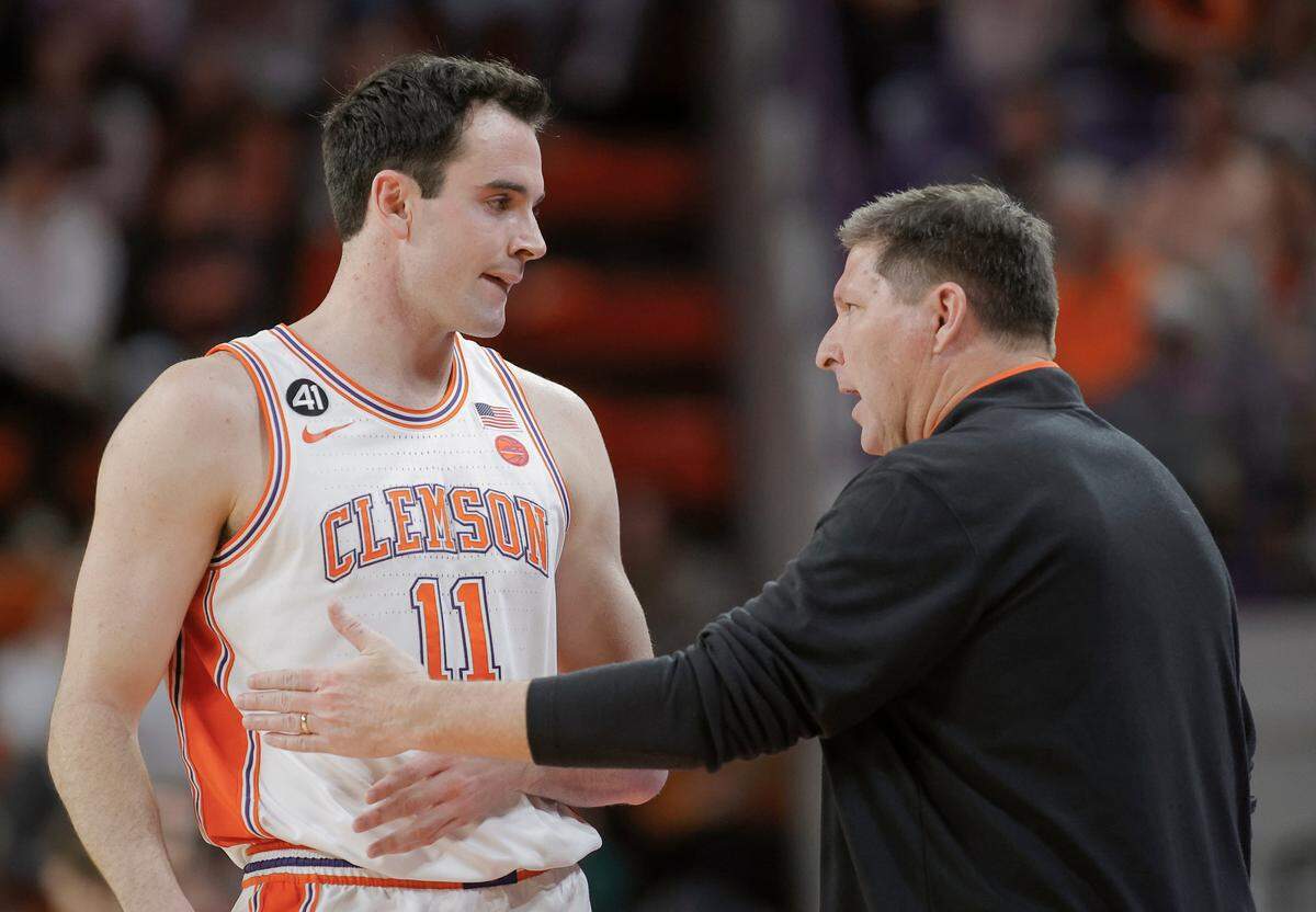 Clemson head coach Brad Brownell talks to forward Nick Davidson during the Boston College game in Clemson on Jan. 13.