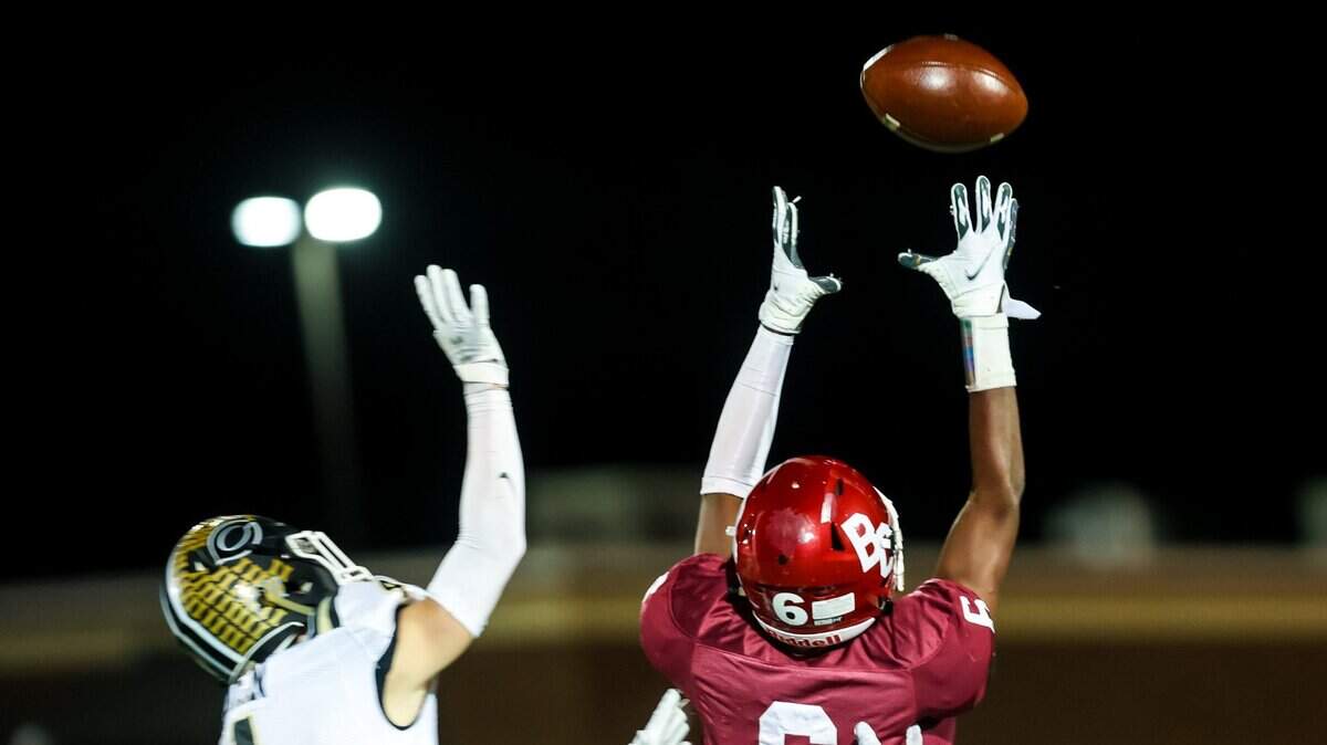 Brookland-Cayce Bearcats Skylar King (6) makes a reception over Camden Bulldogs Henry Green (4) before running for a long touchdown in a playoff game Friday, Nov. 19, 2021 at Brookland-Cayce High School in Cayce, SC.