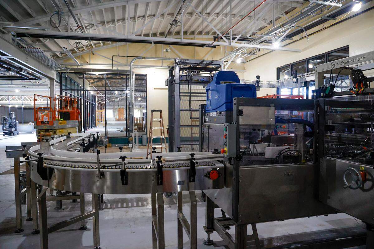 The automated packaging line is set up at Peak Drift Brewing Company. The massive development is taking shape inside the former textile warehouse on North Main Street once occupied by Stone Manufacturing. In addition to the brewery, packaging line and lab, the 64,849-square-foot building will house a full restaurant with indoor and outdoor seating, a bowling alley and a members-only gym.