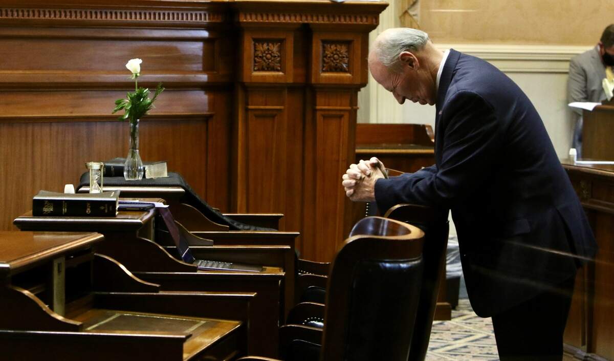 State Sen. Thomas Alexander, R-Oconee prays at the late Hugh Leatherman’s desk, ahead of session on Monday, Dec. 6.