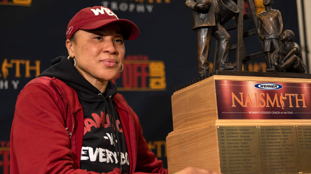 South Carolina coach Dawn Staley poses with a trophy after being named Naismith Women’s College Coach of the Year, Wednesday, March 30, 2022, in Minneapolis. (Carlos Gonzalez/Star Tribune via AP)