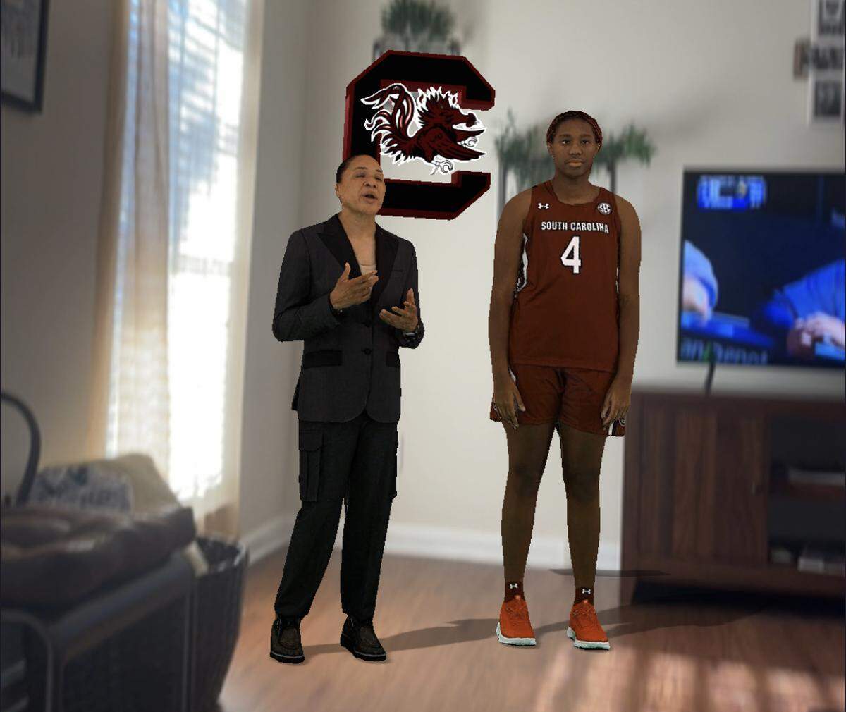 In an augmented reality video called “Score the Shot,” holograms of Dawn Staley and Aliyah Boston will deliver a public service announcement promoting youth COVID-19 vaccinations through the camera lens of a smartphone or tablet. The PSA goes live Friday