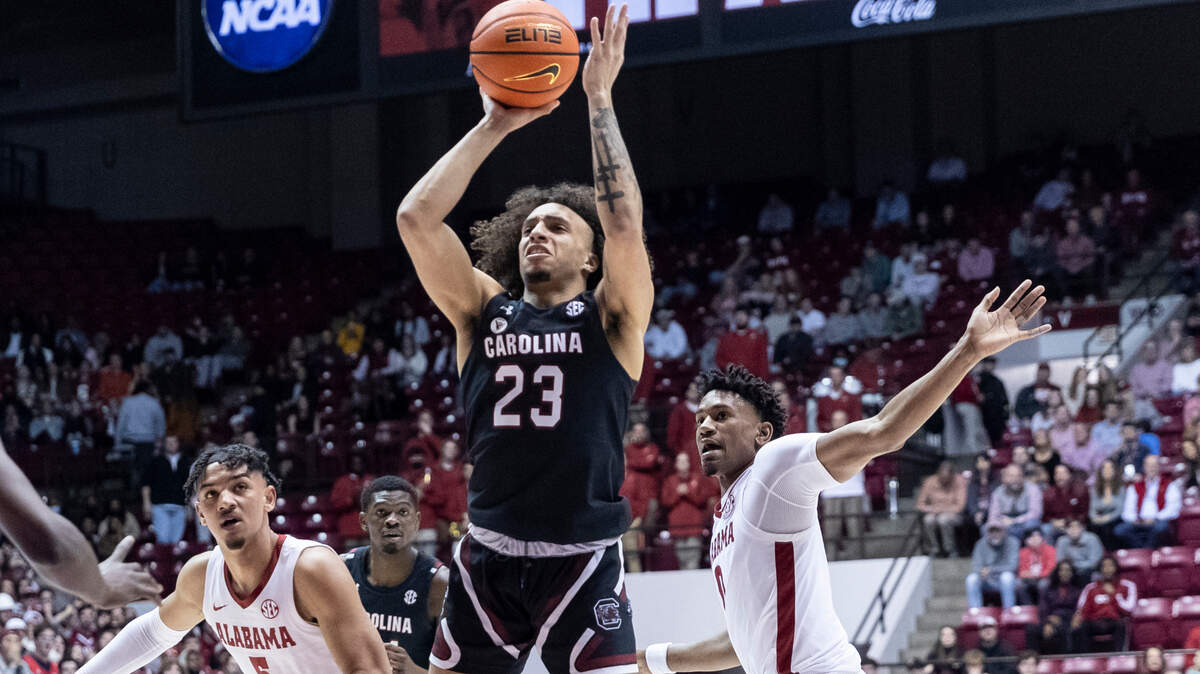 South Carolina guard Devin Carter (23) shoots a jump shot against Alabama during the first half of an NCAA college basketball game, Saturday, Feb. 26, 2022, in Tuscaloosa, Ala. (AP Photo/Vasha Hunt)