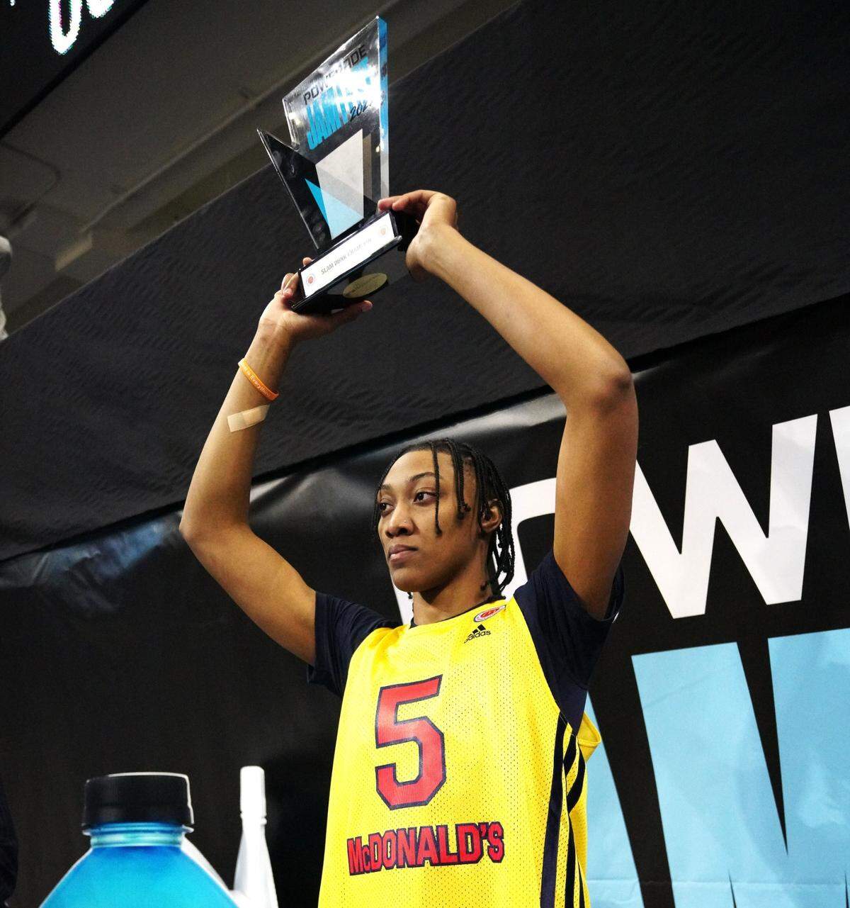 Ashlyn Watkins holds up the trophy after winning the slam dunk contest at the Powerade Jame Fest for the McDonald’s All-American Game on Monday, March 28, 2022.